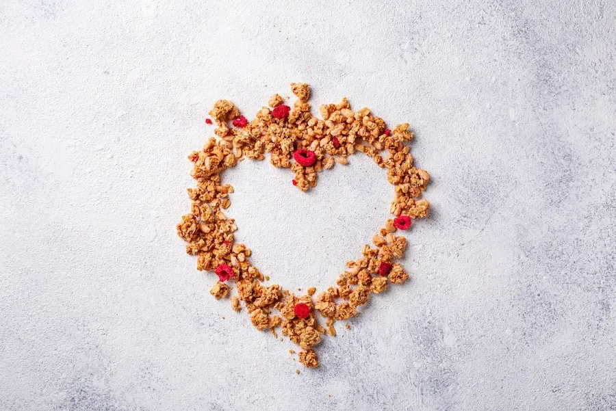 What role do heart-healthy ingredients play in TFL Original Granola?