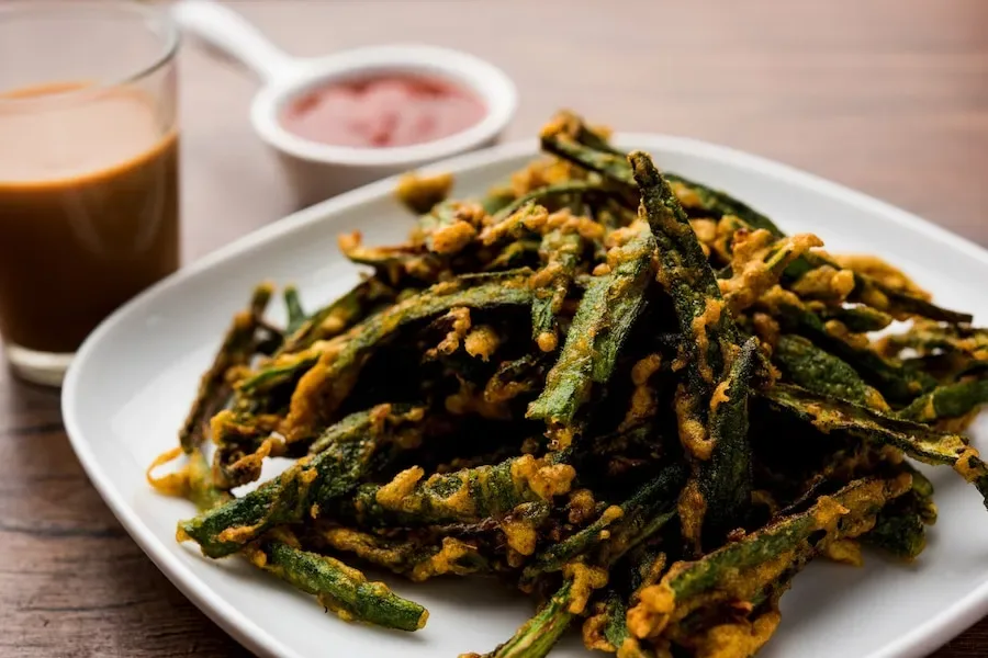 How does masala crispy bhindi elevate the humble ladyfinger into a gourmet snack?